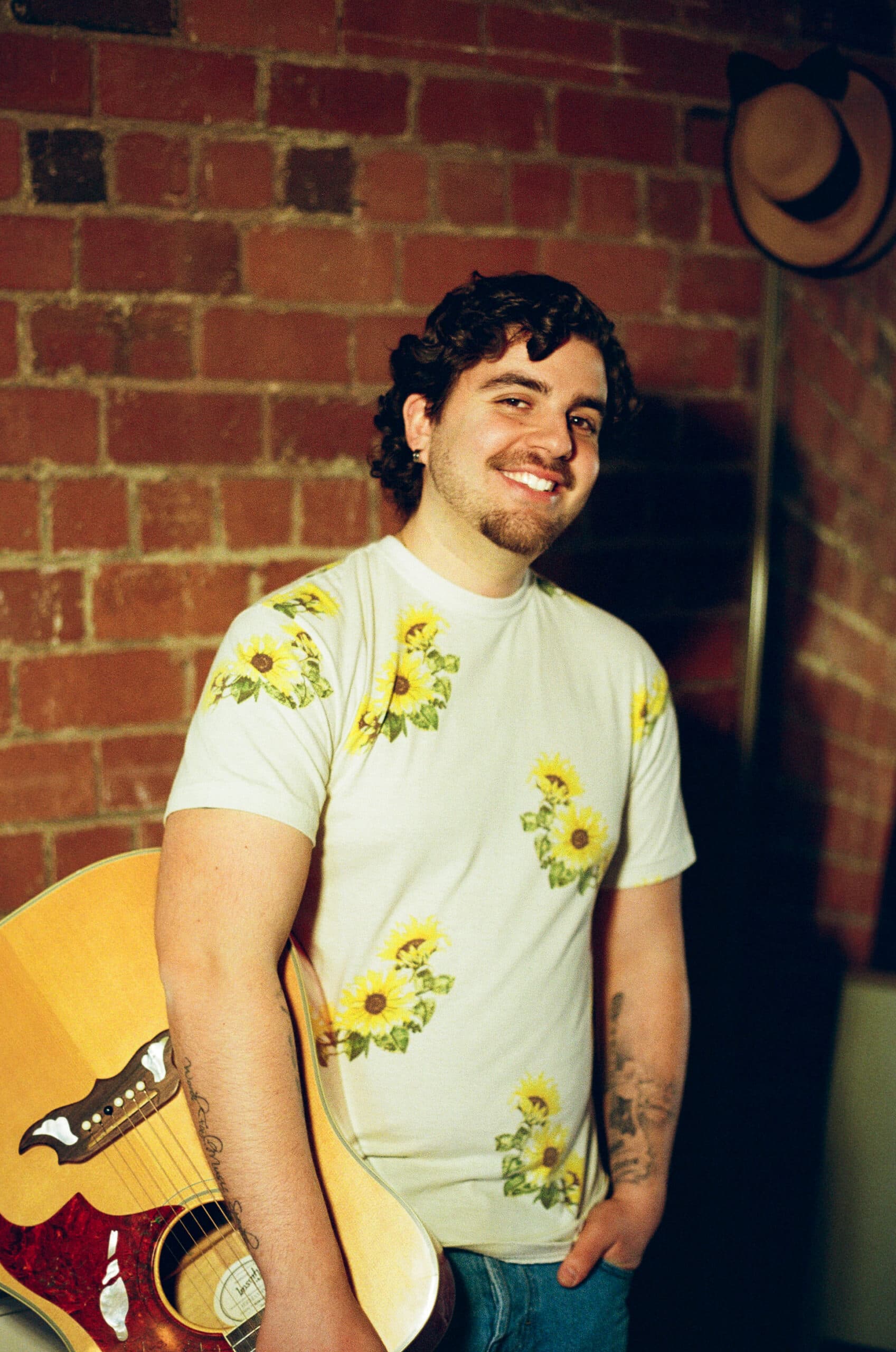 Matt Von singer-songwriter holding a guitar.